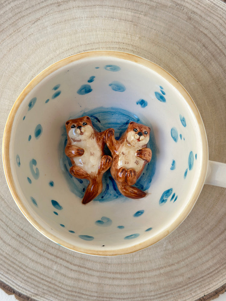 Sea otters handmade mug