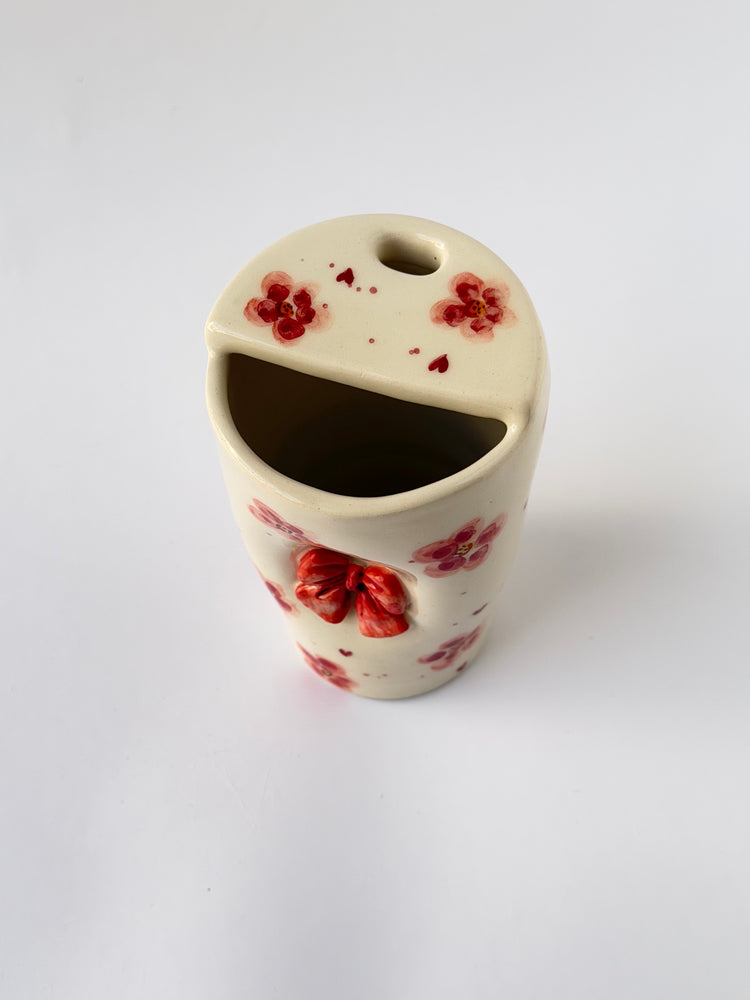 Pink handmade ceramic takeaway mug