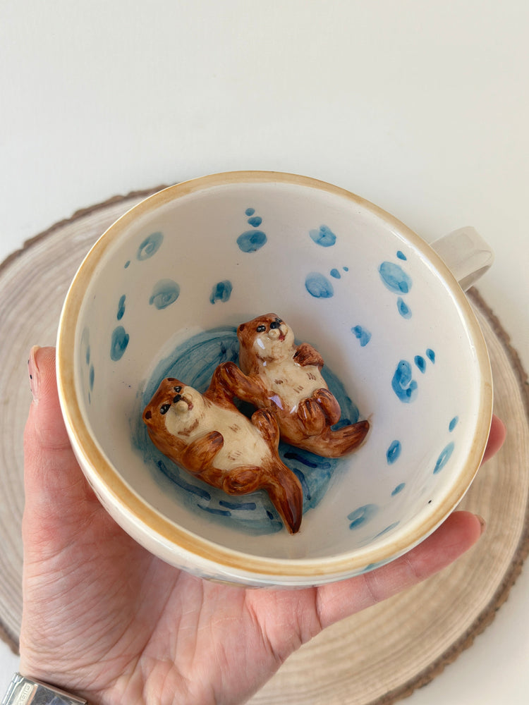 Sea otters handmade mug